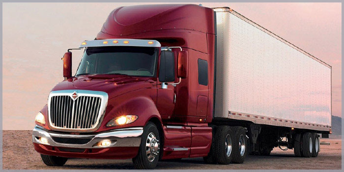 Image of a transport truck and trailer to symbolize our involvement with transportation law.